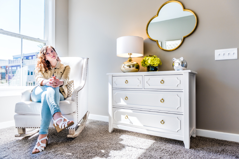 Bright white modern rocking chair in nursery room